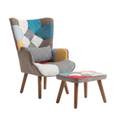 Fauteuil design patchwork multicolore en tissu, style contemporain, avec coussin et structure en bois visible.