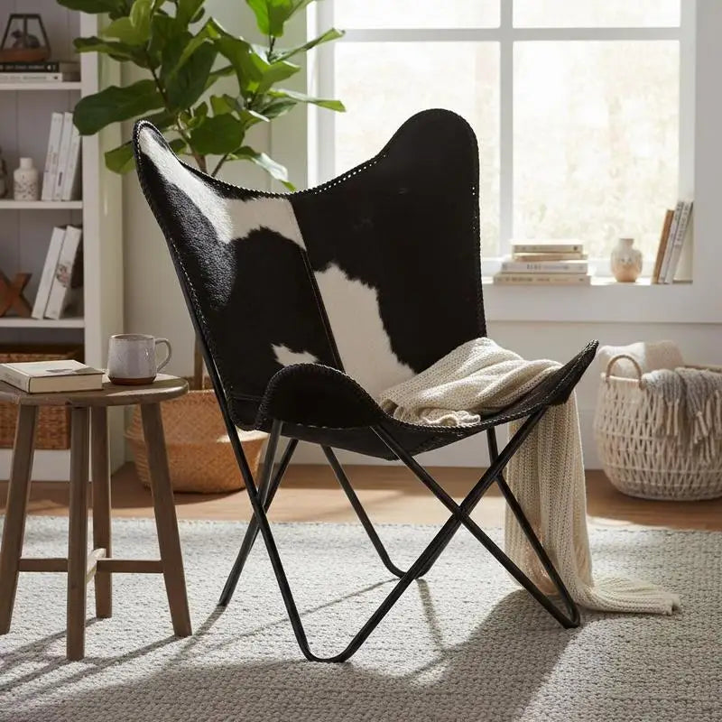 Fauteuil papillon en cuir de vachette