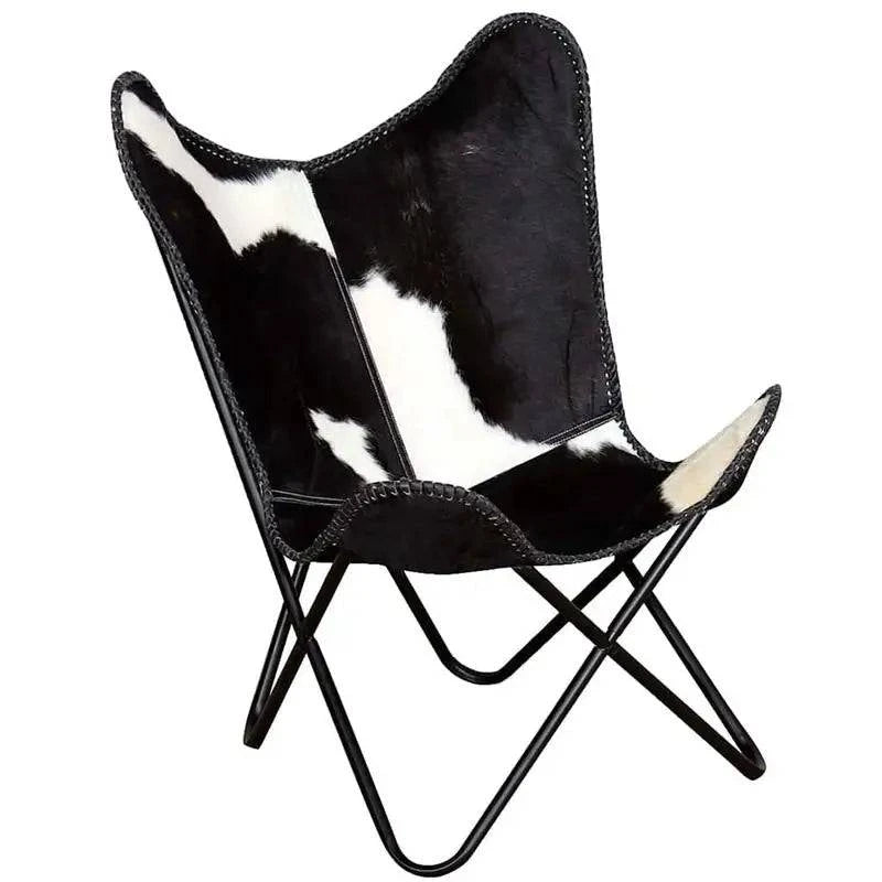 Fauteuil papillon en cuir de vachette véritable, assise et dossier rembourrés, structure en bois, style moderne et élégant.