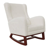 Fauteuil à bascule confortable pour l'allaitement, avec coussin moelleux et structure en bois, idéal pour se relaxer.