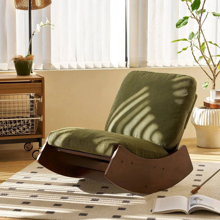 Fauteuil à bascule design contemporain en tissu gris clair, structure en bois, assise confortable, idéal pour le salon.
