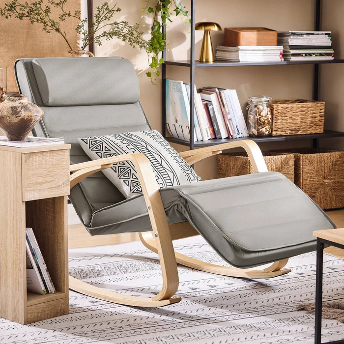 Fauteuil bascule tendance gris, en tissu confortable, idéal pour salon ou espace détente, design moderne et élégant.