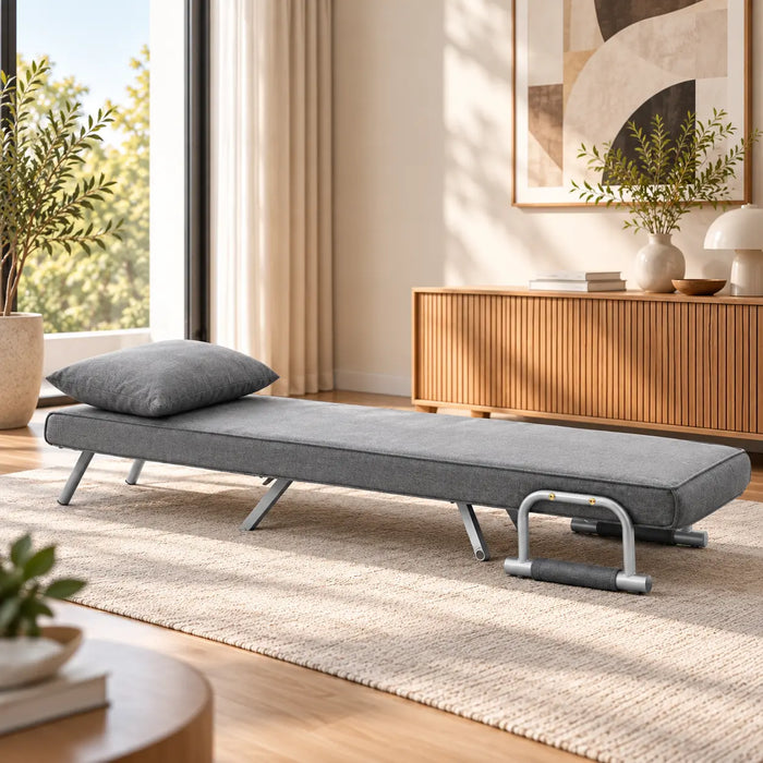Fauteuil convertible gris avec coussin