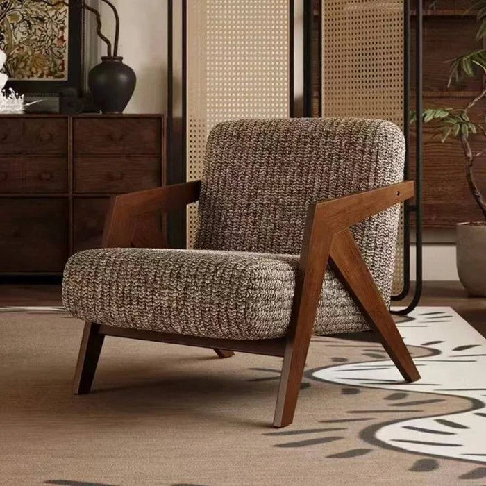 Fauteuil individuel en tissu avec cadre en bois
